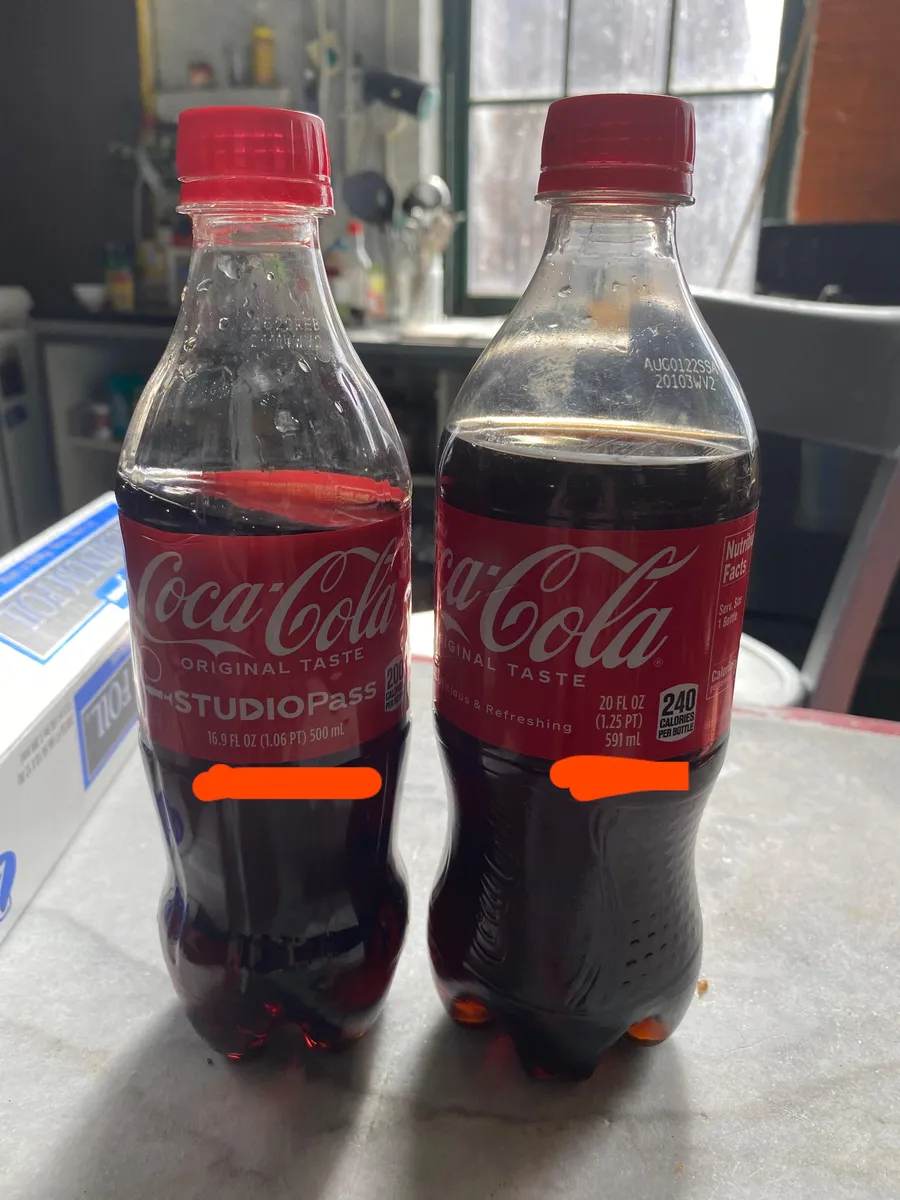 Coca-Cola bottled beverage — 20fl oz to 16.9fl oz