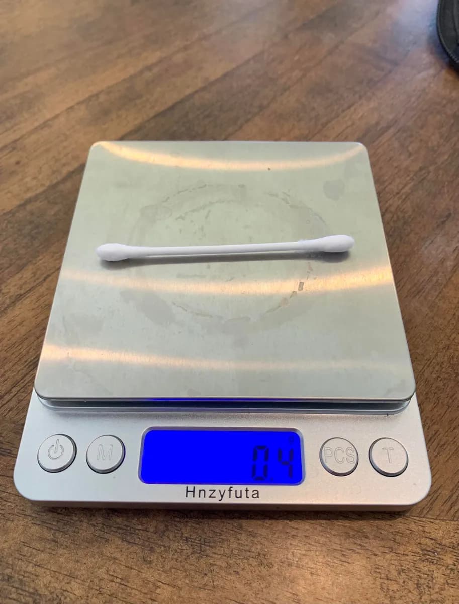 Unilever Q-Tips — 0.5g to 0.4g